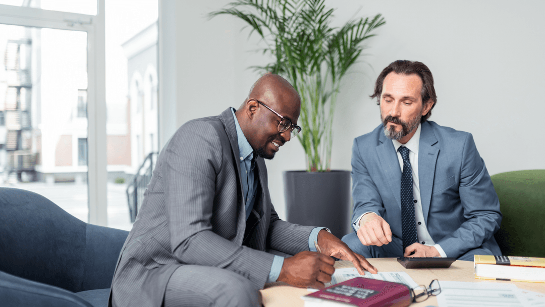 Business owner reviewing property tax rendition documents with a tax consultant
