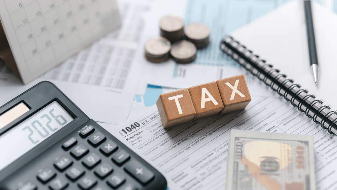 Calculator displaying 2026 beside tax documents for Texas property tax changes