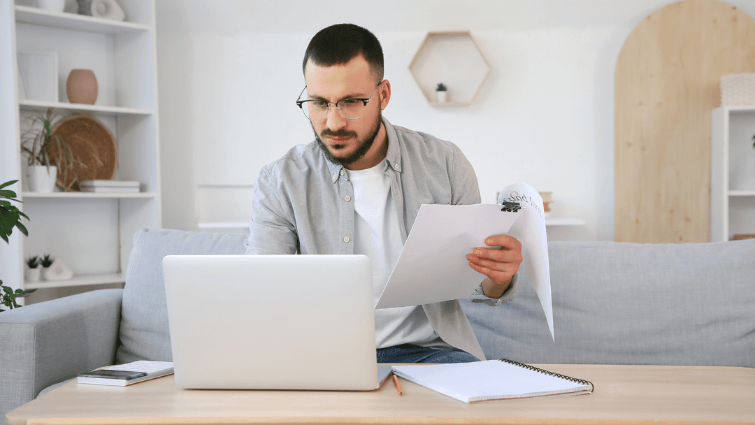 Homeowner reviewing documents to file a property tax overpayment refund claim