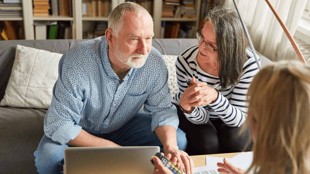 Senior couple reviewing Texas senior property tax exemption details with advisor