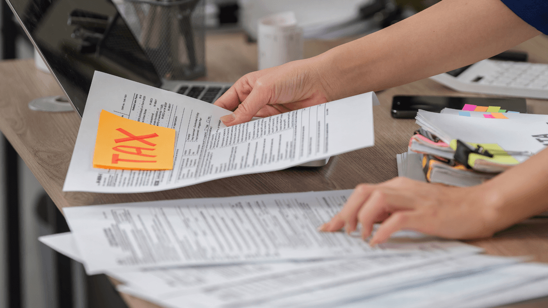 Homeowner reviewing tax forms and paperwork while preparing a Travis County property tax appeal