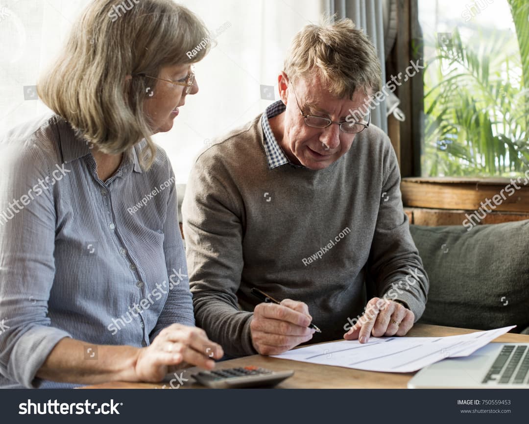 Harris County homeowner reviewing a homestead exemption application and property tax documents at home.