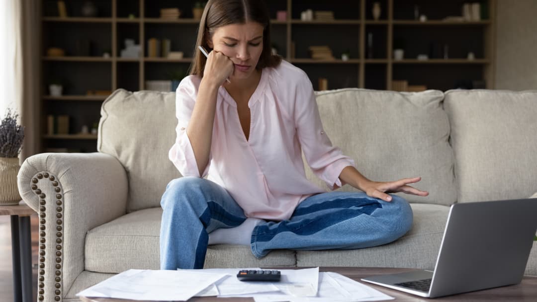 Homeowner reviewing property tax papers after her homestead cap shows $0