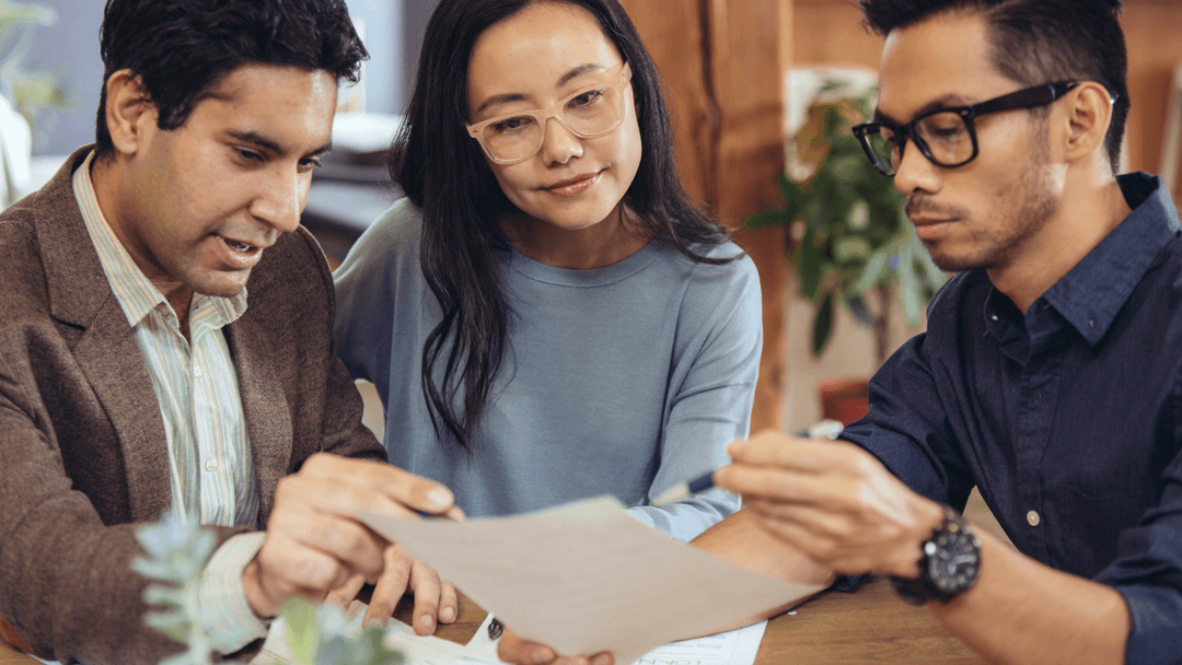 Texas homeowners discussing appraisal notice checkboxes with a tax professional